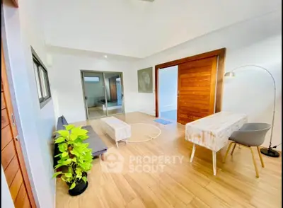 Spacious modern living room with wooden flooring and stylish decor