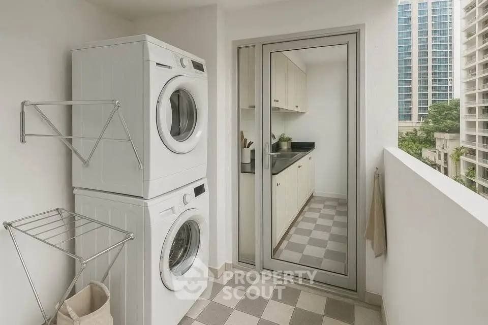 Modern laundry area with stacked washer and dryer on a balcony with city view.