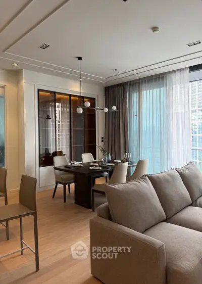 Luxurious modern living room with elegant dining area and floor-to-ceiling windows offering stunning city views.