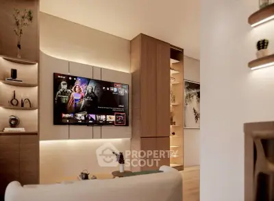 Modern living room with sleek wooden shelves and wall-mounted TV, perfect for entertainment.
