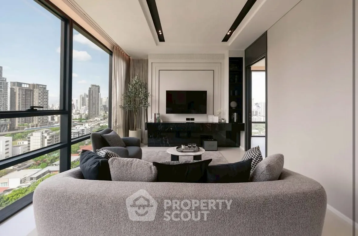 Luxurious modern living room with panoramic city view and elegant decor