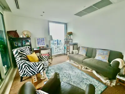 Chic living room with zebra-patterned chair and city view window
