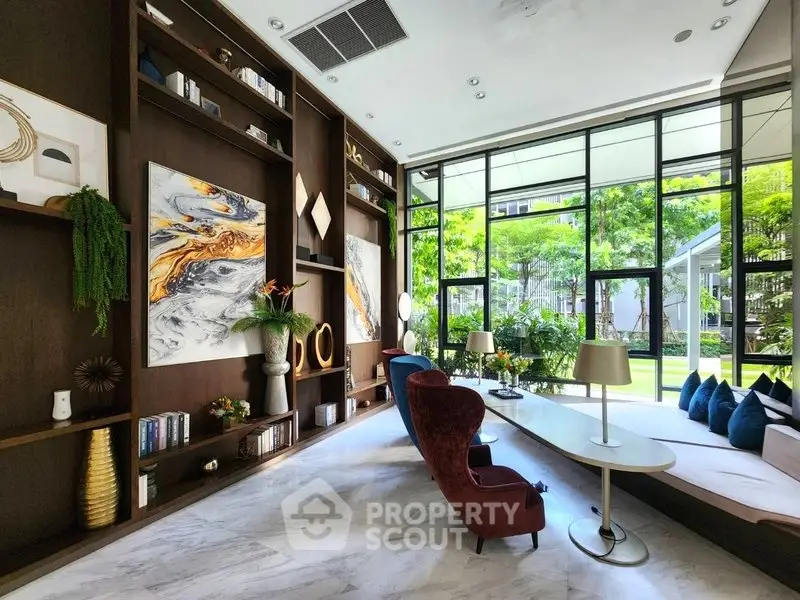 Luxurious living room with floor-to-ceiling windows and elegant decor