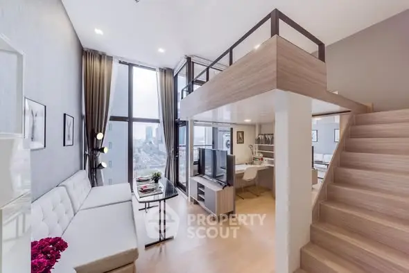 Modern loft apartment with high ceilings and large windows offering stunning city views.