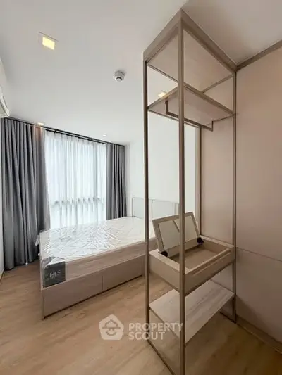 Modern bedroom with stylish wooden furniture and large window with curtains.