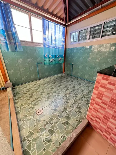 Unique tiled bathroom with vibrant colors and natural light