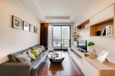 Modern living room with stylish decor and large window view