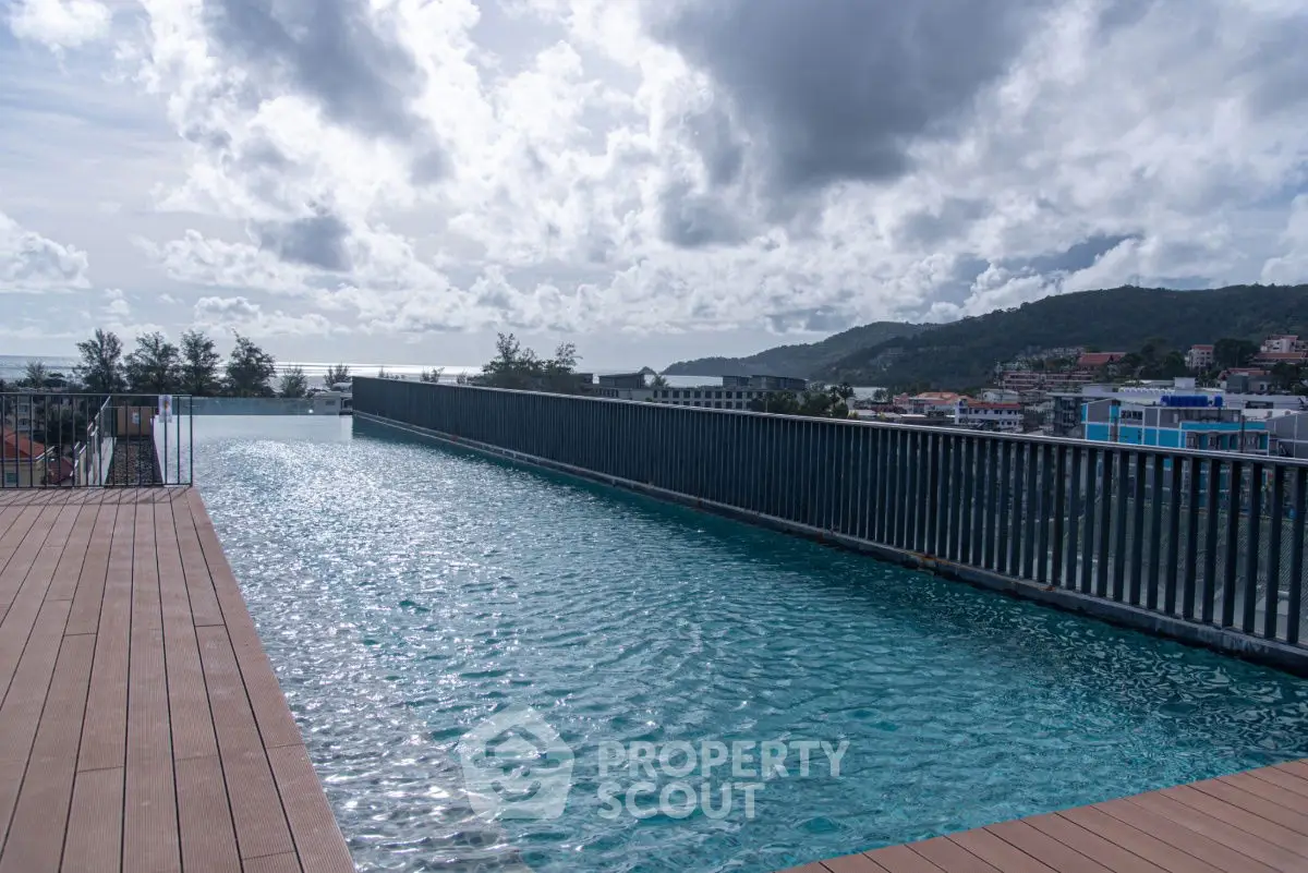 Stunning rooftop infinity pool with panoramic views of the city and mountains.