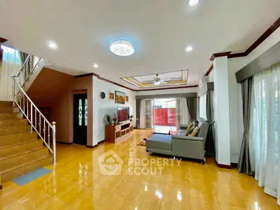 Spacious living room with modern decor and natural light