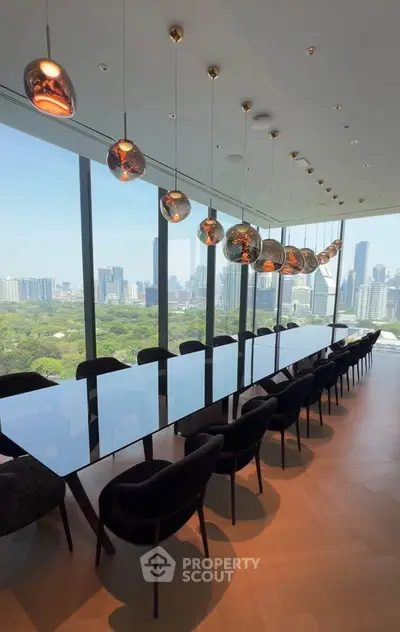 Luxurious dining area with panoramic city views and elegant lighting fixtures.