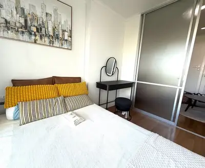 Stylish bedroom with modern decor and sliding closet doors