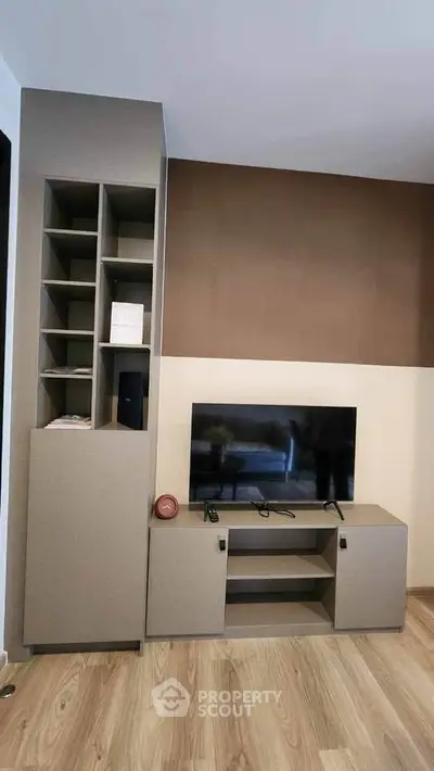 Modern living room with sleek TV unit and stylish shelving, perfect for contemporary home decor.