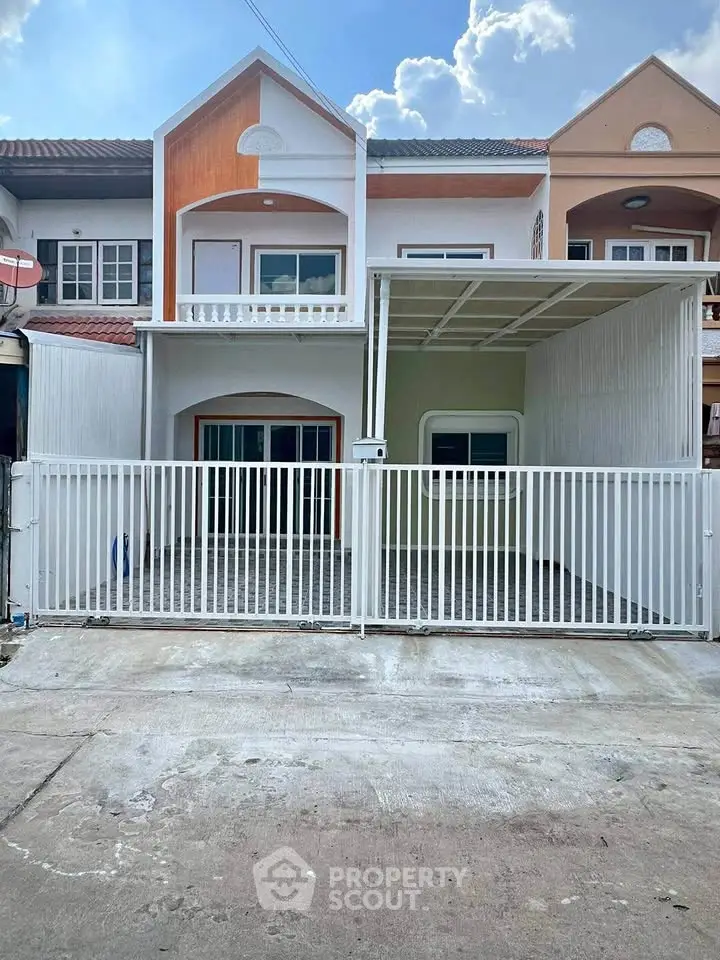Charming townhouse with gated entrance and covered parking in a serene neighborhood.