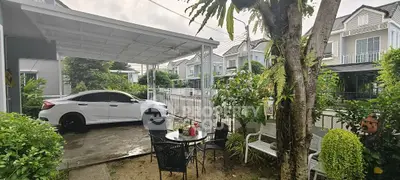 Charming suburban home with carport and lush garden, perfect for outdoor relaxation.