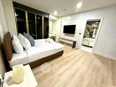 Luxurious modern bedroom with ensuite bathroom and elegant decor