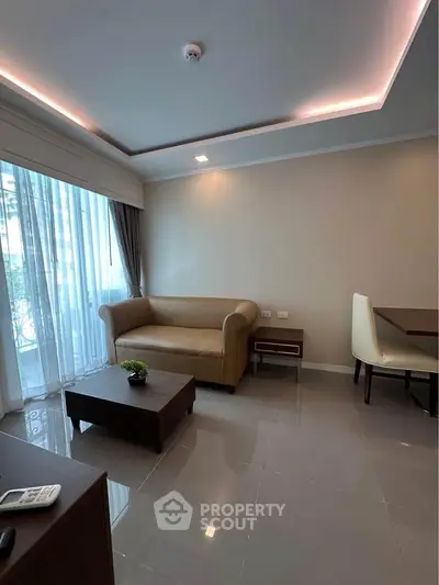 Modern living room with sleek furniture and natural light, perfect for relaxation and entertaining.