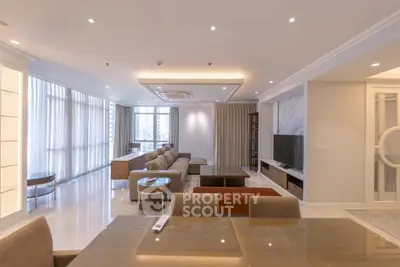 Spacious modern living room with elegant decor and large windows