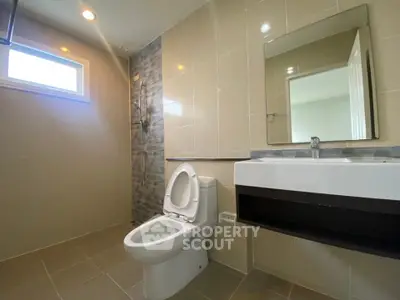 Modern bathroom with sleek fixtures and natural lighting