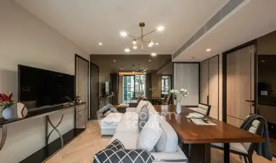 Modern living room with elegant decor and spacious dining area in luxury apartment.