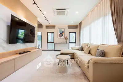 Spacious modern living room with large windows and elegant decor