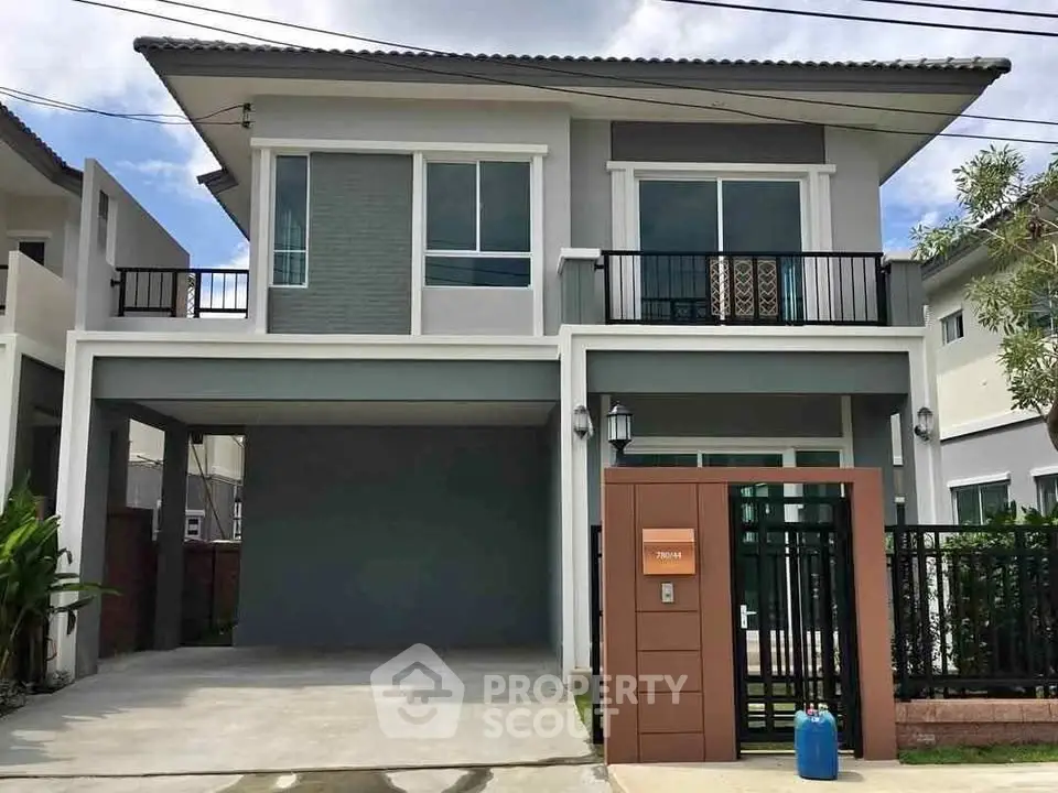 Modern two-story house with spacious driveway and stylish facade