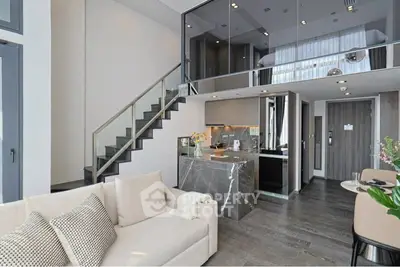 Luxurious modern living room with mezzanine and sleek kitchen design