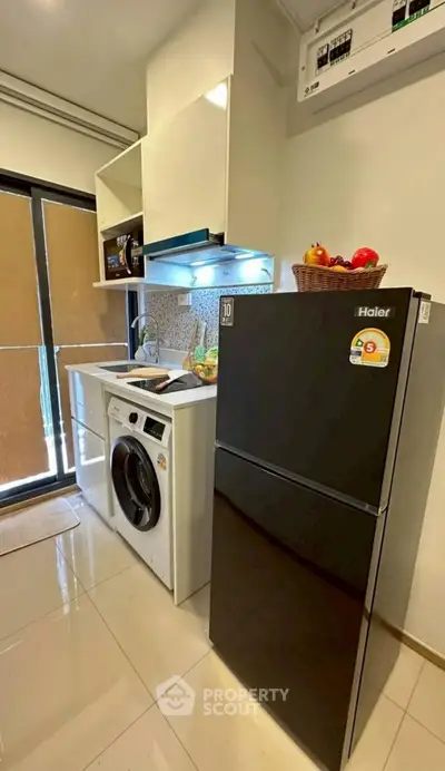 Modern kitchen with sleek appliances and ample storage space