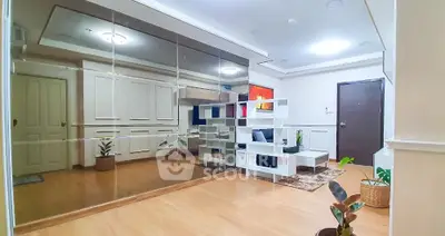 Spacious living room with mirrored wall and modern decor