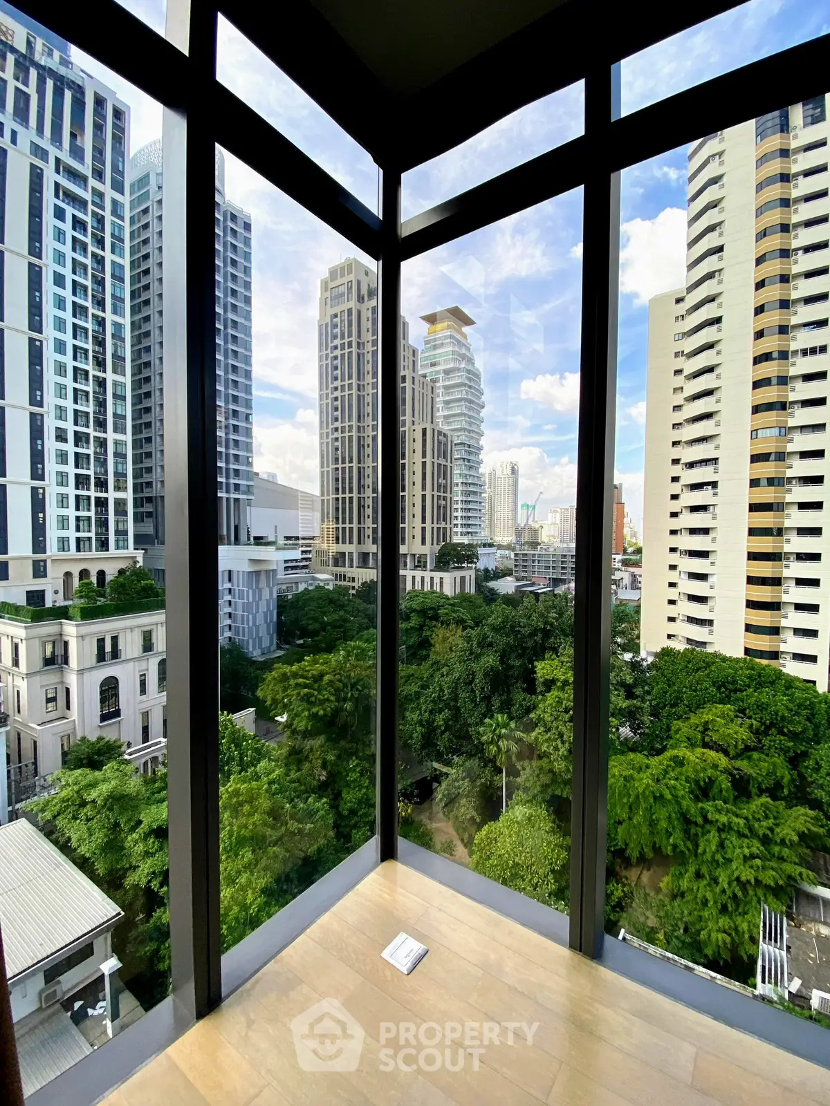 Stunning corner unit with floor-to-ceiling windows offering a breathtaking cityscape view.