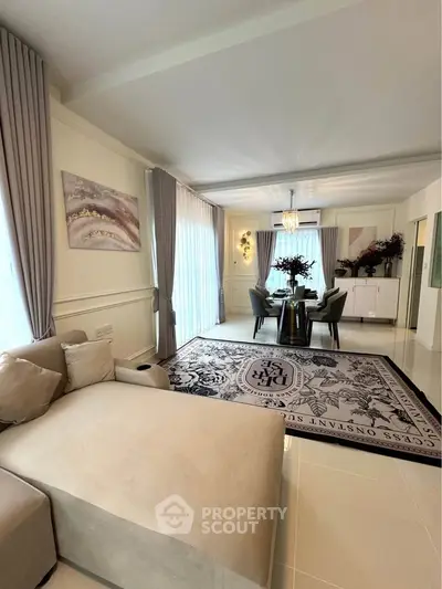 Luxurious living room with elegant decor and spacious dining area