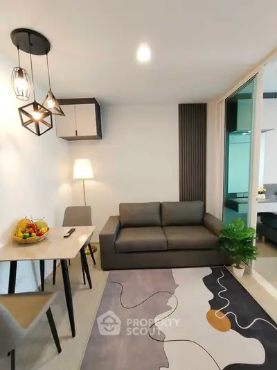 Modern living room with stylish decor, cozy sofa, and elegant lighting in a contemporary apartment.