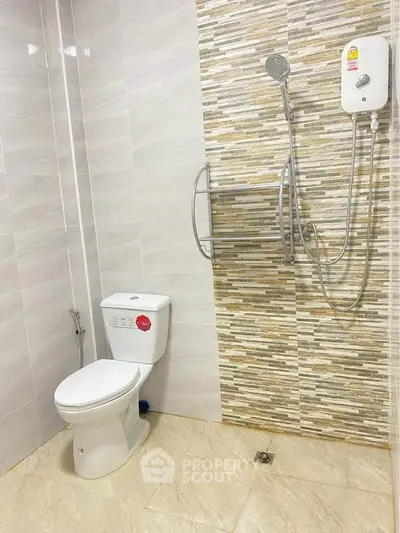 Modern bathroom with sleek shower and stylish tile design, perfect for contemporary living.