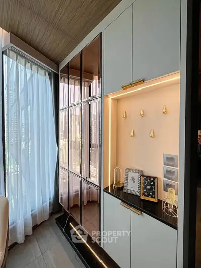 Luxurious modern living room with floor-to-ceiling windows and elegant cabinetry