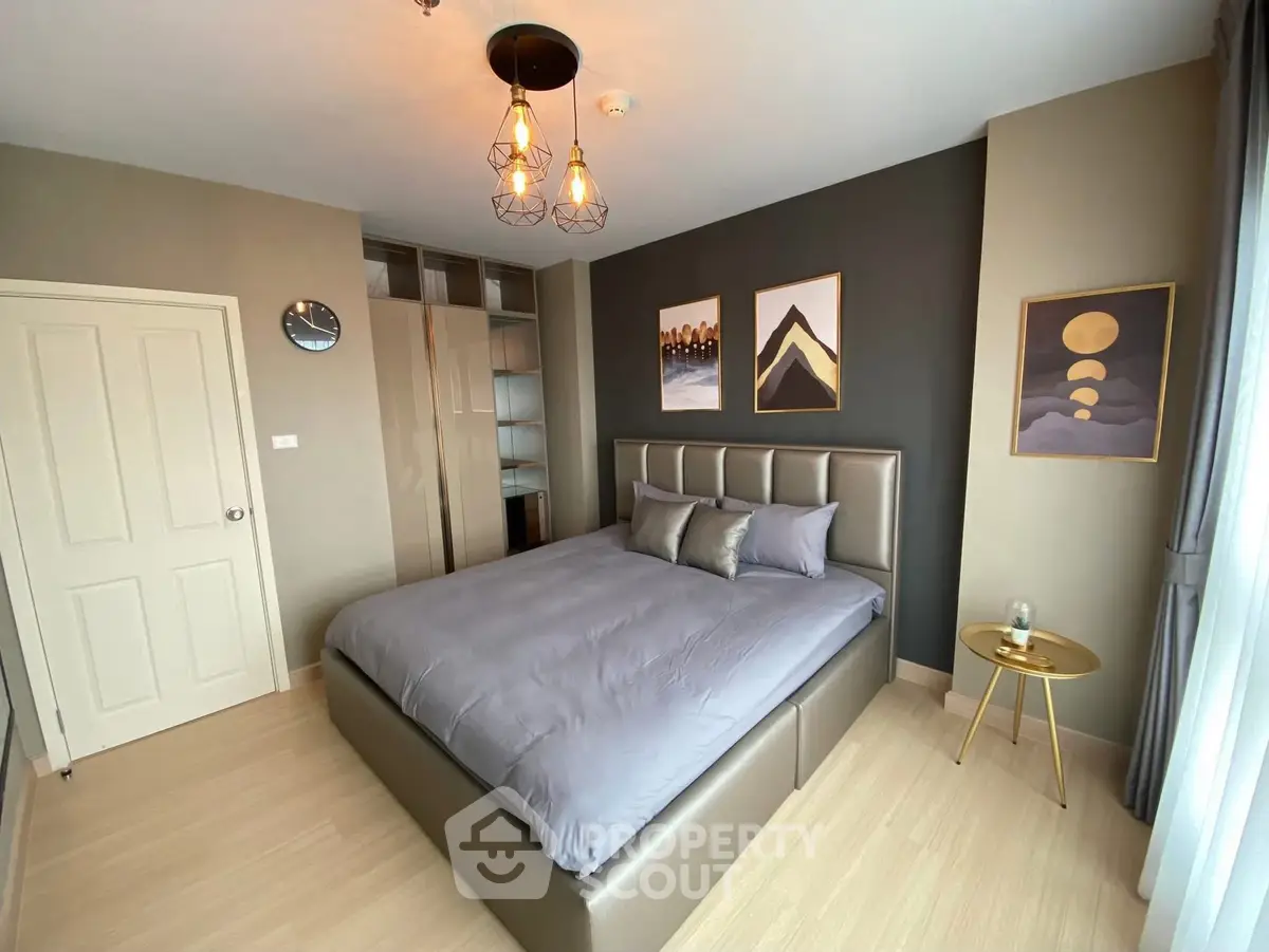 Modern bedroom with stylish decor and ample natural light