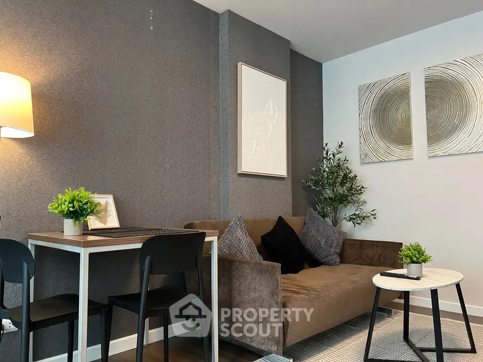 Modern living room with stylish decor, cozy sofa, and elegant wall art in a contemporary apartment.