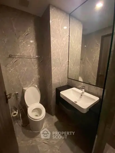 Modern bathroom with sleek design and elegant fixtures in a contemporary home.