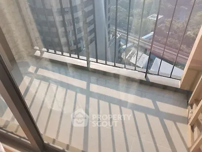 Spacious balcony with city view and modern railing design
