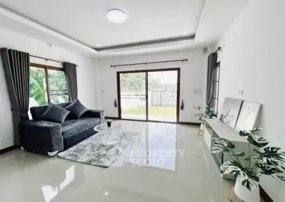 Spacious living room with modern decor and garden view