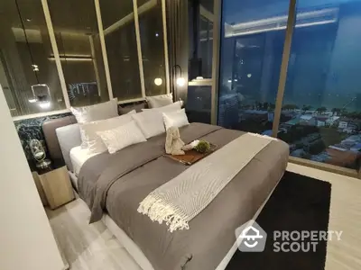 Luxurious modern bedroom with panoramic city view and elegant decor