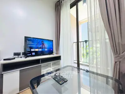 Modern living room with TV and balcony view in stylish apartment