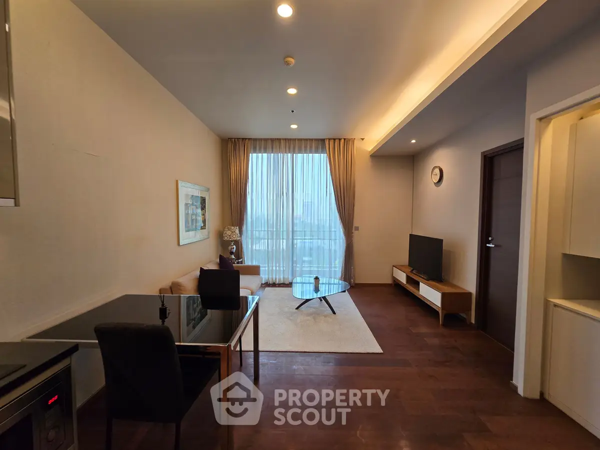 Modern living room with elegant decor and large window offering city view