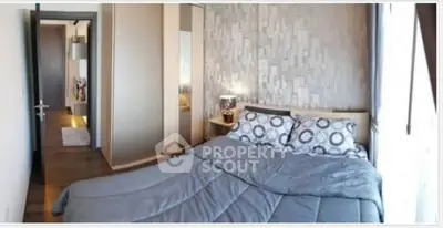 Cozy bedroom with modern decor and ample natural light