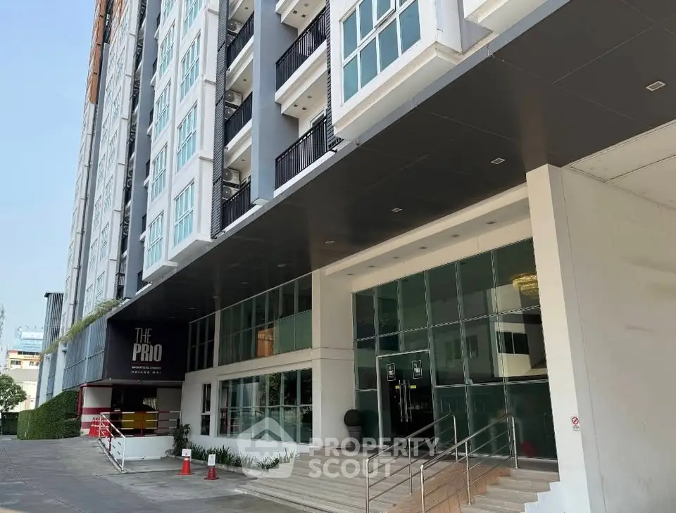 Modern building entrance with sleek design and glass facade