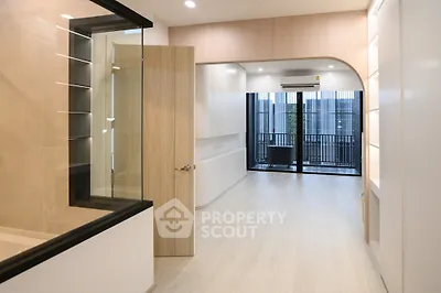 Modern apartment interior with open layout and balcony view