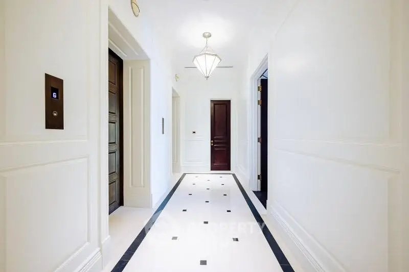 Elegant hallway with elevators and modern lighting in luxury building