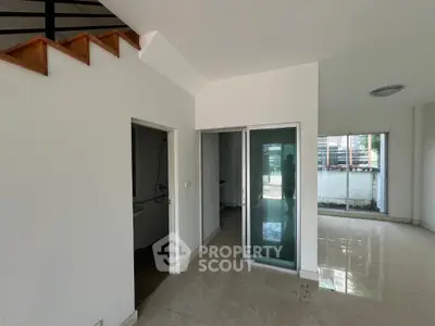 Spacious modern interior with glossy floors and sliding glass door