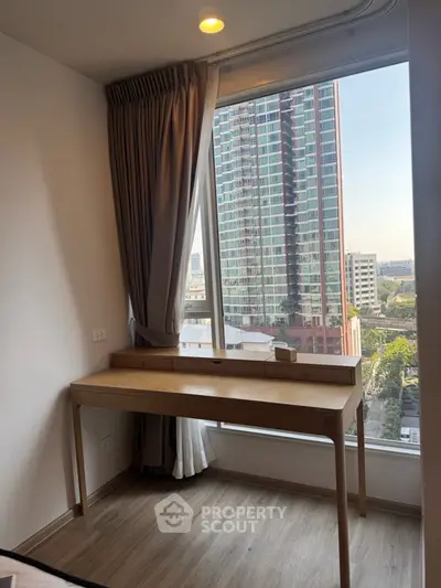 Modern study area with city view in high-rise apartment