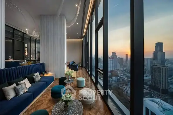 Luxurious high-rise living room with panoramic city views at sunset, featuring elegant decor and plush seating.