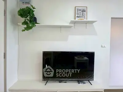 Modern living room with sleek TV and minimalist decor