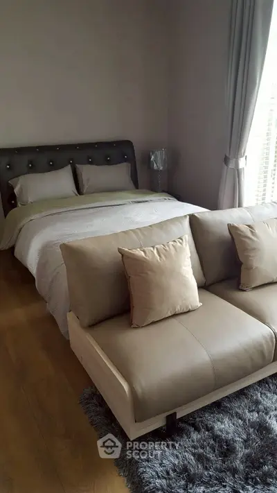 Luxurious bedroom with elegant decor and plush furnishings, featuring a stylish bed and cozy seating area.